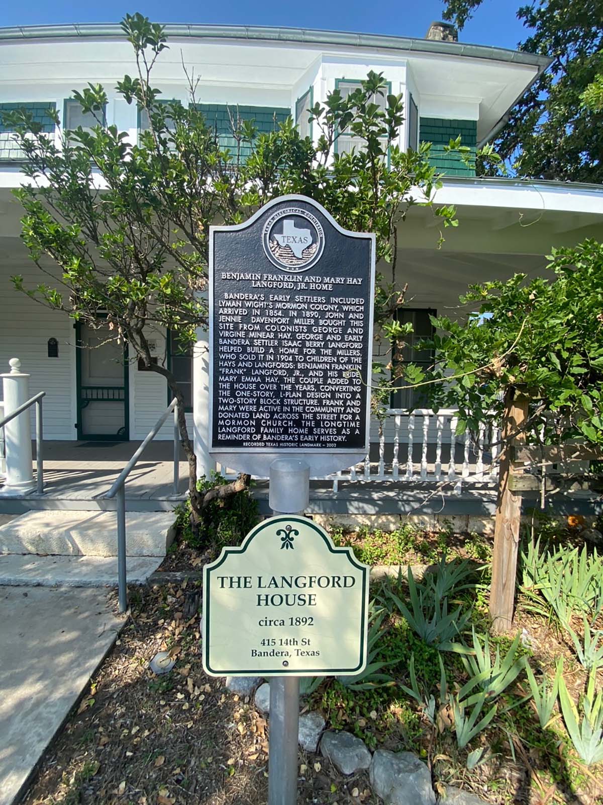 A historical marker in front of the langford house.